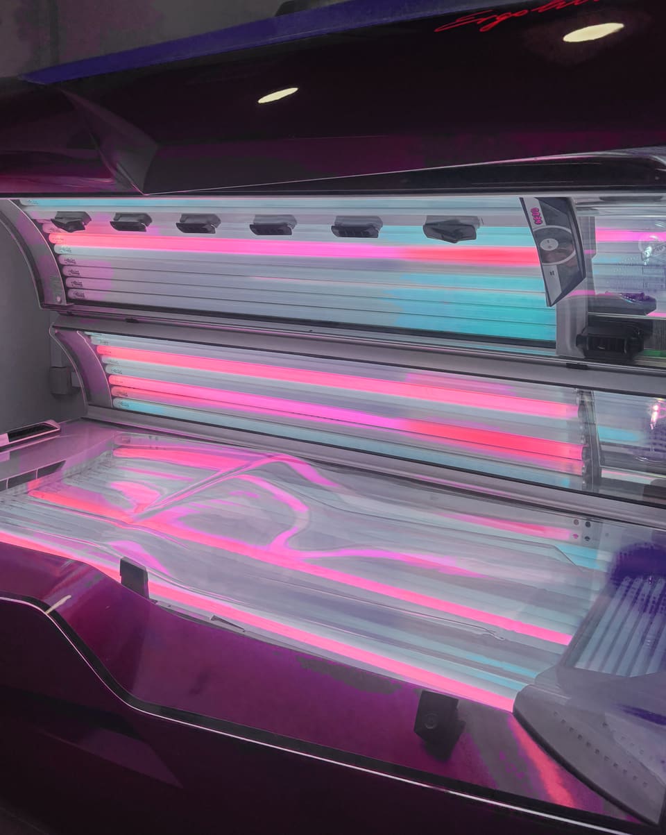 One of the lie down Ergoline sunbeds with its canopy up
