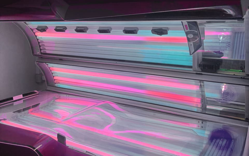 One of the lie down Ergoline sunbeds with its canopy up